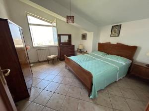 Letto o letti in una camera di Casetta a Cavarretta