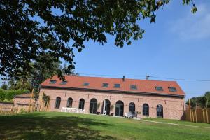 a large brick building with a red roof at LA GRANGE in Anzin-Saint-Aubin +13 photos