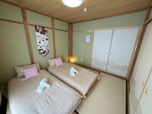 Voodi või voodid majutusasutuse 木香の家-天下茶屋 toas