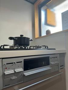 Köök või kööginurk majutusasutuses 木香の家-天下茶屋