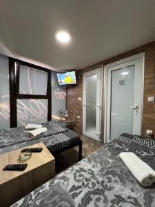 Postel nebo postele na pokoji v ubytování Berić Rooms