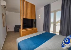 Postelja oz. postelje v sobi nastanitve Moonlight Hotel