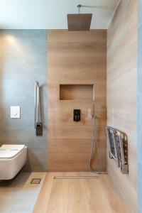 a bathroom with a white toilet and a sink at Villa Sophia in Kalliópi