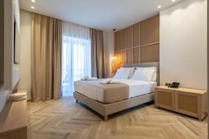 a bedroom with a bed and a large window at Villa Sophia in Kalliópi +43 photos