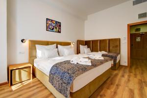 Postel nebo postele na pokoji v ubytování Hotel Karlova Prague