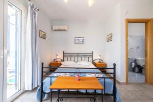 Posteľ alebo postele v izbe v ubytovaní Agnadi Blue Apartments