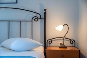 Posteľ alebo postele v izbe v ubytovaní Agnadi Blue Apartments