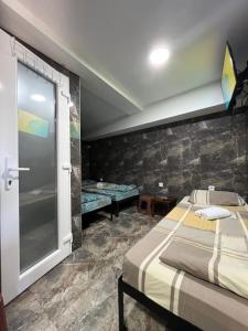 Postel nebo postele na pokoji v ubytování Berić Rooms