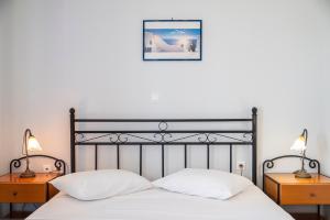 Posteľ alebo postele v izbe v ubytovaní Agnadi Blue Apartments