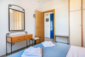 Posteľ alebo postele v izbe v ubytovaní Agnadi Blue Apartments