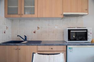 Kuchyňa alebo kuchynka v ubytovaní Agnadi Blue Apartments