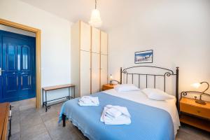 Posteľ alebo postele v izbe v ubytovaní Agnadi Blue Apartments
