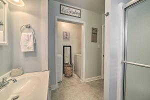 a bathroom with a tub and a sink and a shower at Dreamcatchers in North Beach +17 photos