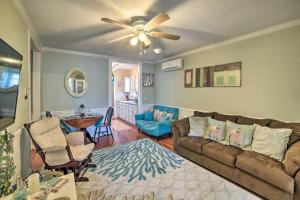 a living room with a couch and a ceiling fan at Dreamcatchers in North Beach