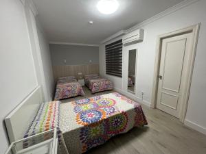Postel nebo postele na pokoji v ubytování Hotel Dila