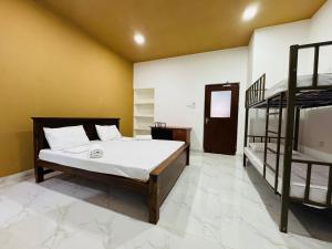 Uma cama ou camas num quarto em Havelock City Hostel, Colombo