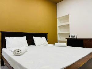 Uma cama ou camas num quarto em Havelock City Hostel, Colombo
