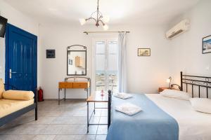 Posteľ alebo postele v izbe v ubytovaní Agnadi Blue Apartments