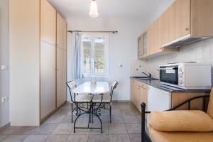 Kuchyňa alebo kuchynka v ubytovaní Agnadi Blue Apartments