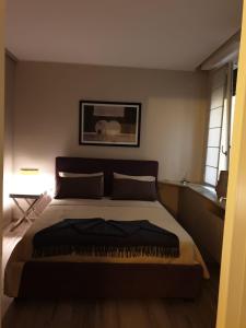 a bedroom with a large bed in a room at Casa delle Farfalle in Bologna