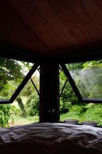 Postel nebo postele na pokoji v ubytování Samsu Cabins