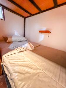 Postel nebo postele na pokoji v ubytování Hangout's Hostel El Nido