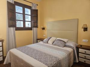 Posteľ alebo postele v izbe v ubytovaní Alojamiento Rural Casitas Cueva del Gato