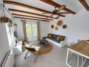 a living room with a couch and a table at Villa Estrella de Mar in Moraira