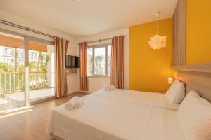 Postel nebo postele na pokoji v ubytování Ladonia Hotels Mio Bianco