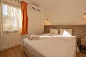 Postel nebo postele na pokoji v ubytování Ladonia Hotels Mio Bianco