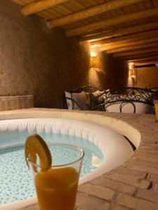 a drink with a slice of lemon in a tub at La Maison Berber Shams in Marrakech