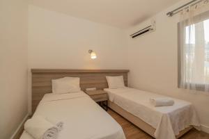 Postel nebo postele na pokoji v ubytování Ladonia Hotels Mio Bianco