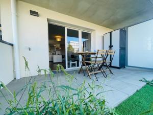 a patio with a table and chairs on it at Casa Bella in Angers