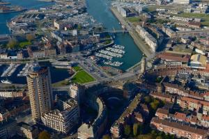an aerial view of a city with a river and buildings at Casa Luciano in Dunkerque
