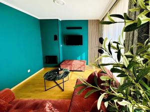 a living room with a couch and a table at Casa Luciano in Dunkerque
