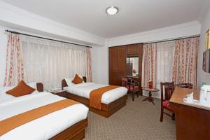 Voodi või voodid majutusasutuse Fuji Hotel toas