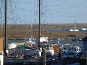 a group of boats docked at a marina at AnchorageWells Entire Cottage OR a King Ensuite on Room Only in Wells next the Sea
