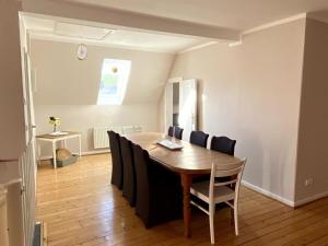 a dining room with a table and chairs at Sophienhof Lieselotte in Neuenkirchen