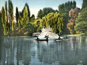 a painting of boats on a lake with trees at Studio Cismigiu Park in Bucharest +7 photos