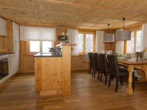 a kitchen and dining room with a table and chairs at Lovely apartment in Schröcken in Schröcken