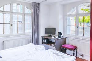 Voodi või voodid majutusasutuse Tralala Hotel Montreux toas