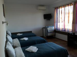 Un pat sau paturi într-o cameră la Guest House Hasiendata