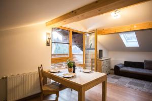 a living room with a table and a couch at Ferienwohnung Walder in Außervillgraten