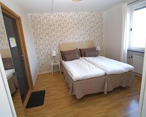 Postel nebo postele na pokoji v ubytování Riverside stay at Hotel - Ängelholm