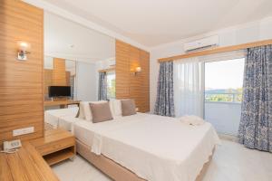 Postel nebo postele na pokoji v ubytování Ladonia Hotels Mio Bianco