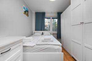 Posteľ alebo postele v izbe v ubytovaní Aleja Jana Pawła II 65 by Homeprime
