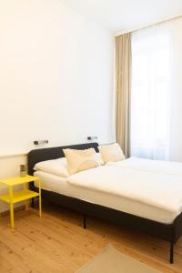 Ein Bett oder Betten in einem Zimmer der Unterkunft KIBI Rooms self check-in
