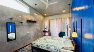 a bedroom with a bed and a window at HappyHideaway in Vagamon