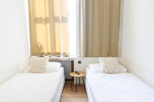 Ein Bett oder Betten in einem Zimmer der Unterkunft KIBI Rooms self check-in
