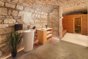A bed or beds in a room at Casati Hotel - Adults Only
